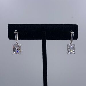New no tags.  Earrings in solid sterling silver, lab diamond emerald cut drops.